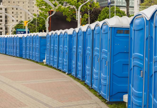 a row of portable restrooms set up for a special event, providing guests with a comfortable and sanitary option in Gales Ferry CT